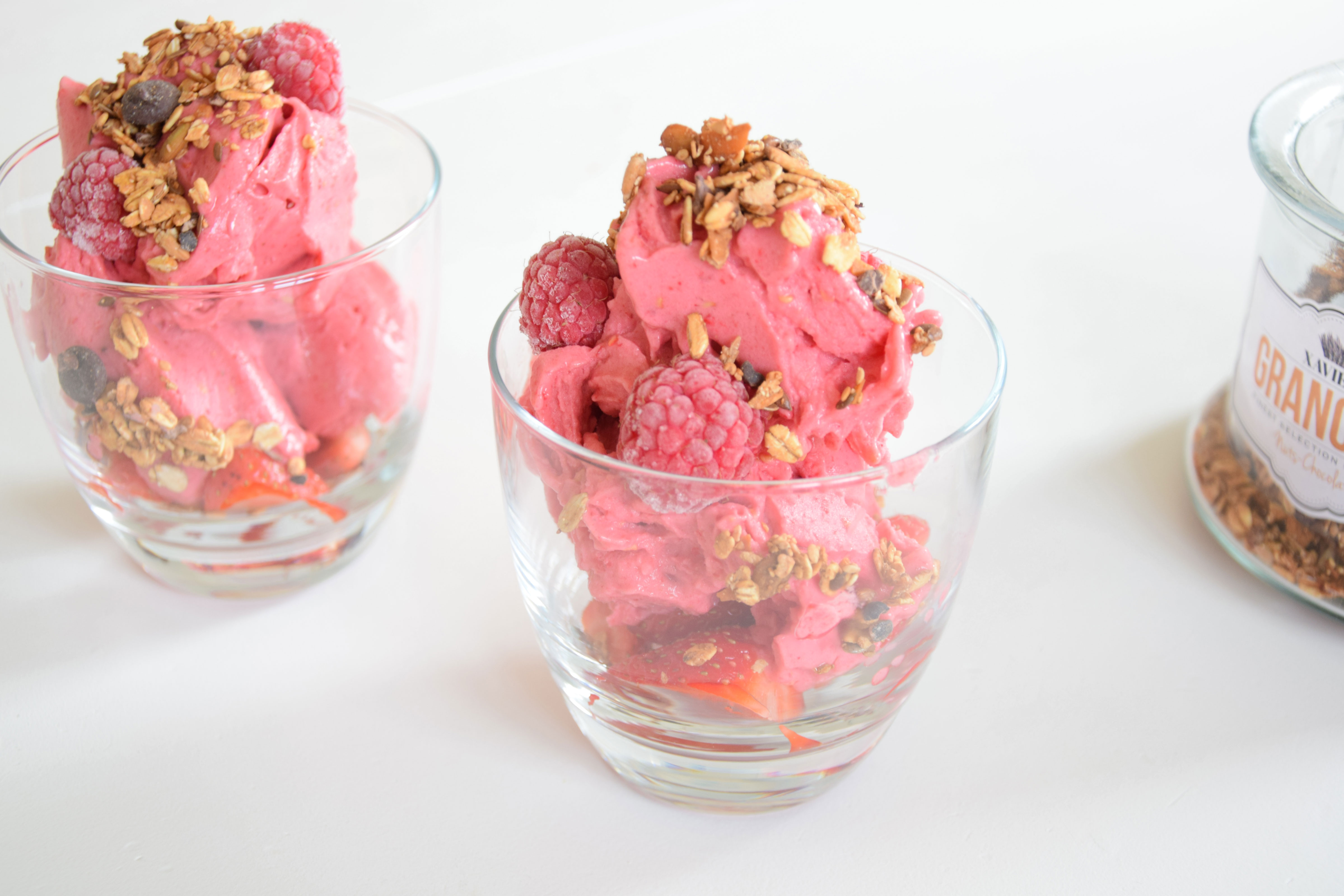 Raspberry nicecream with XAVIES' granola topping - XAVIES’