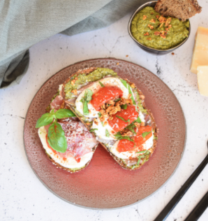 Toast with green pesto, mozzarella and prosciutto and XAVIES' Pure Toasted Nuts & Seeds - XAVIES’